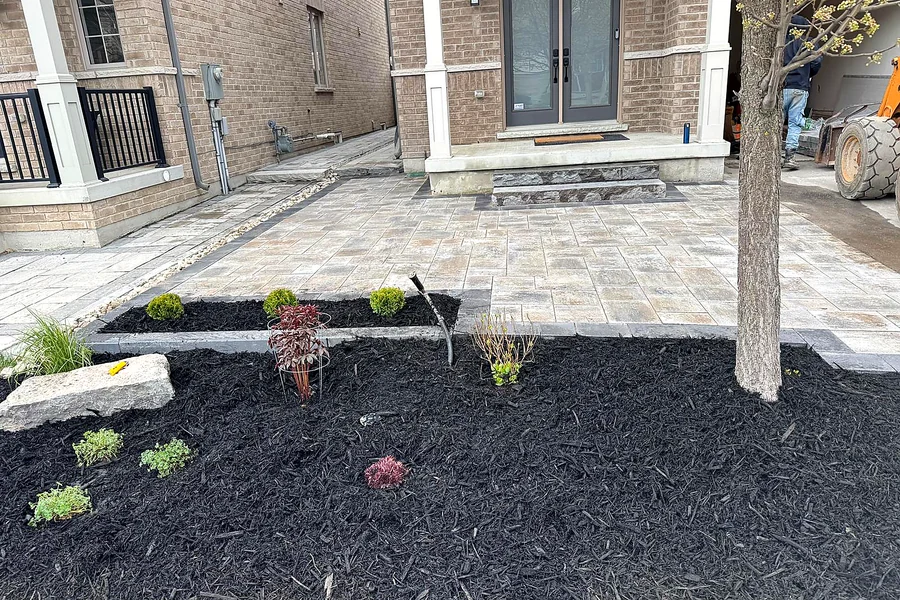 Interlock front entrance with new garden beds