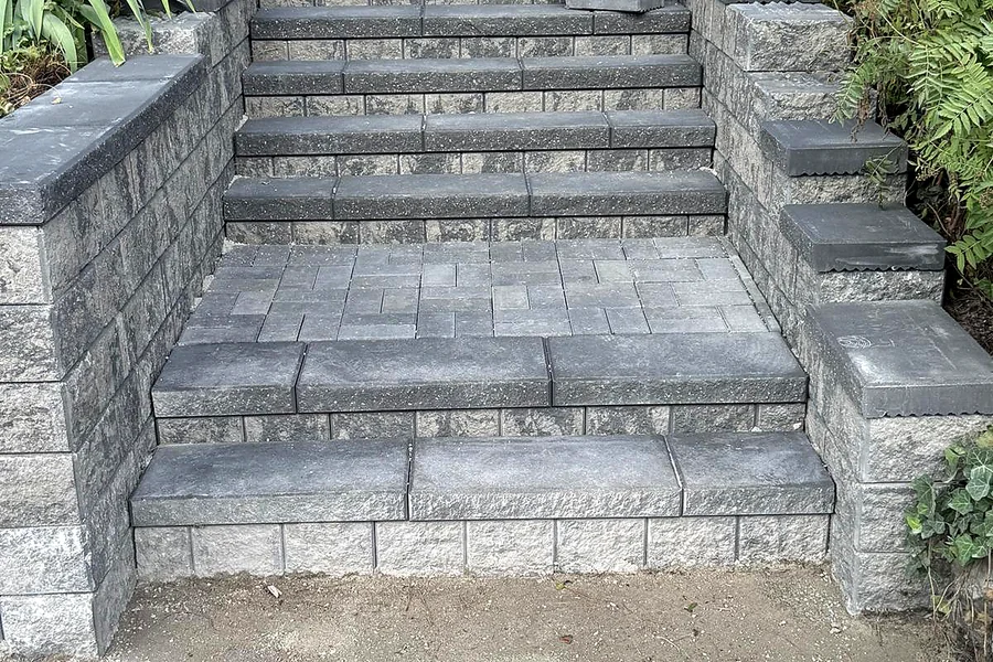 Tiered interlock entry steps with retaining walls