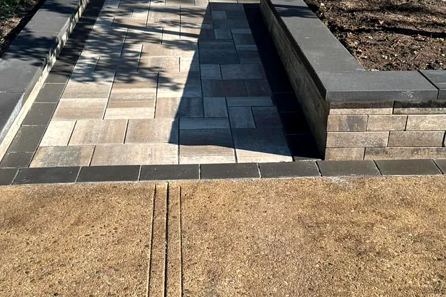 Interlock walkway and steps to a brick entrance